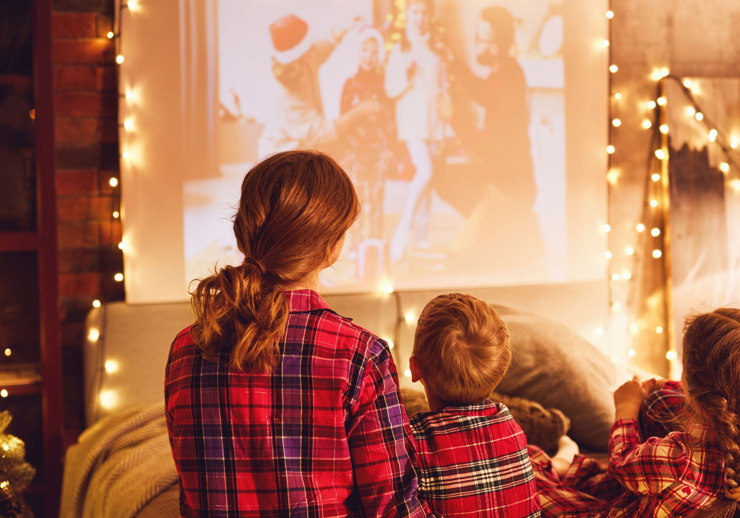 martha brook blog post things to do in between Christmas and New Year family watching a film in pjs fairy lights
