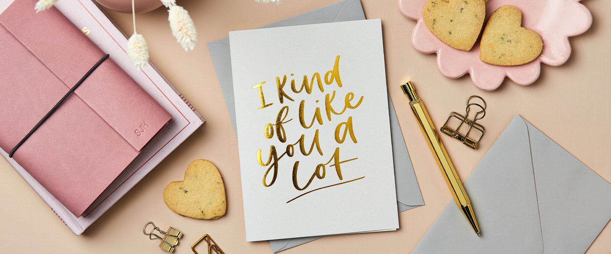 Martha Brook Personalised Like You a Lot Foiled Card with gold pen and a pink notebook