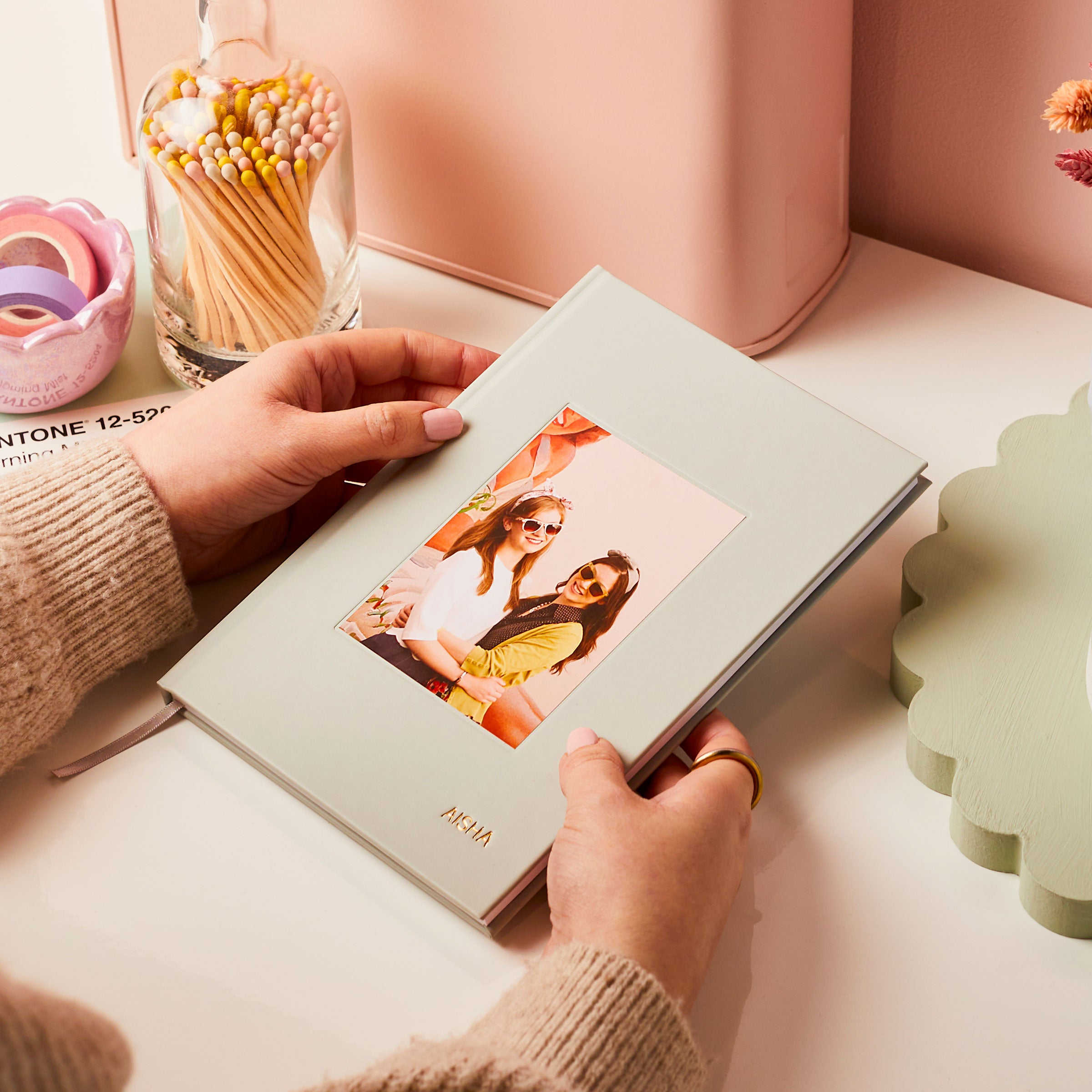 martha brook personalised hardback notebooks photo notebook on a desk with matches and desk accessories with a pink background