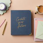 martha brook personalised stationery personalised create your own future life planner navy planner gold foiling on desk