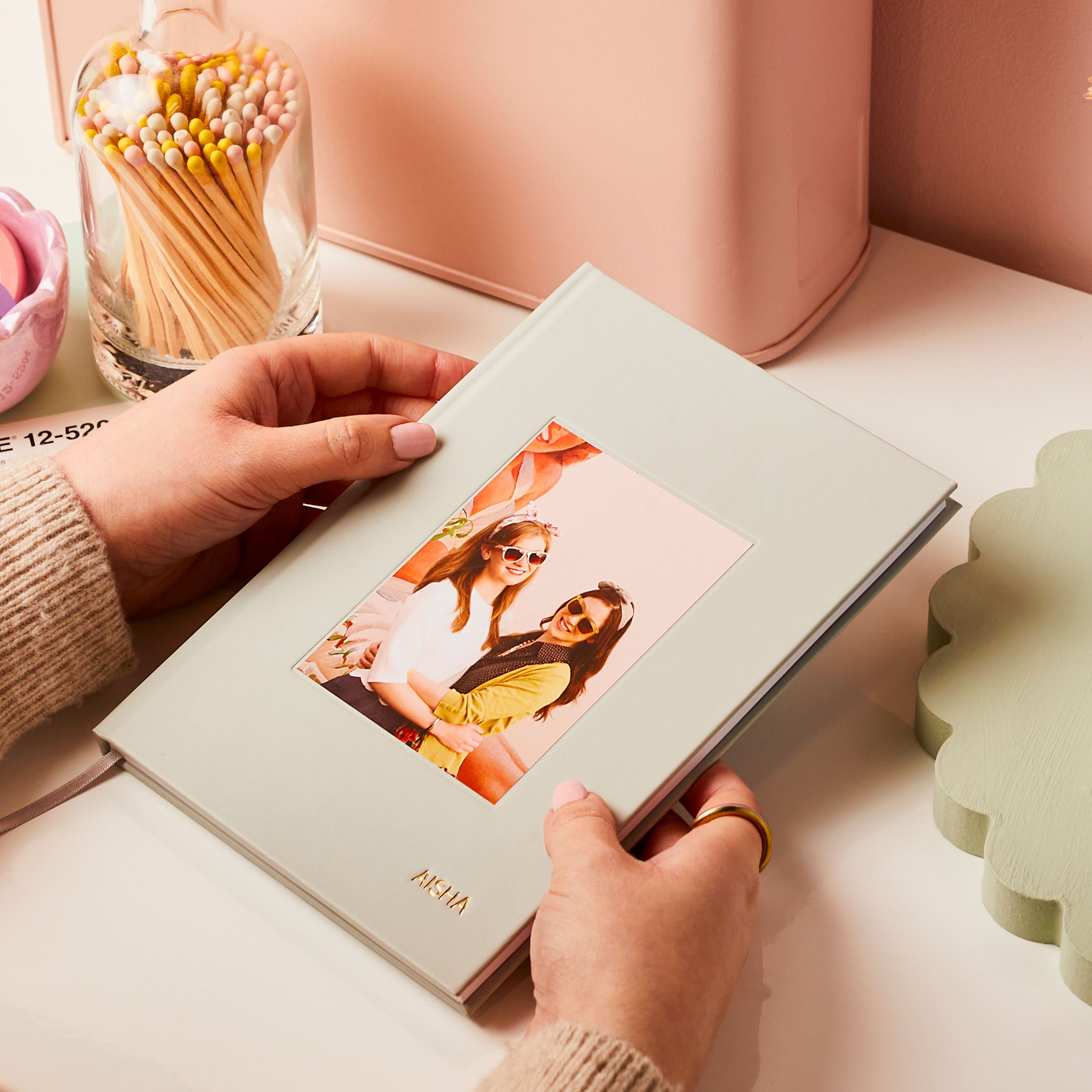 martha brook personalised stationery valentine's day gifts valentines day luxury hardback photo notebook on a desk in hands with two girls