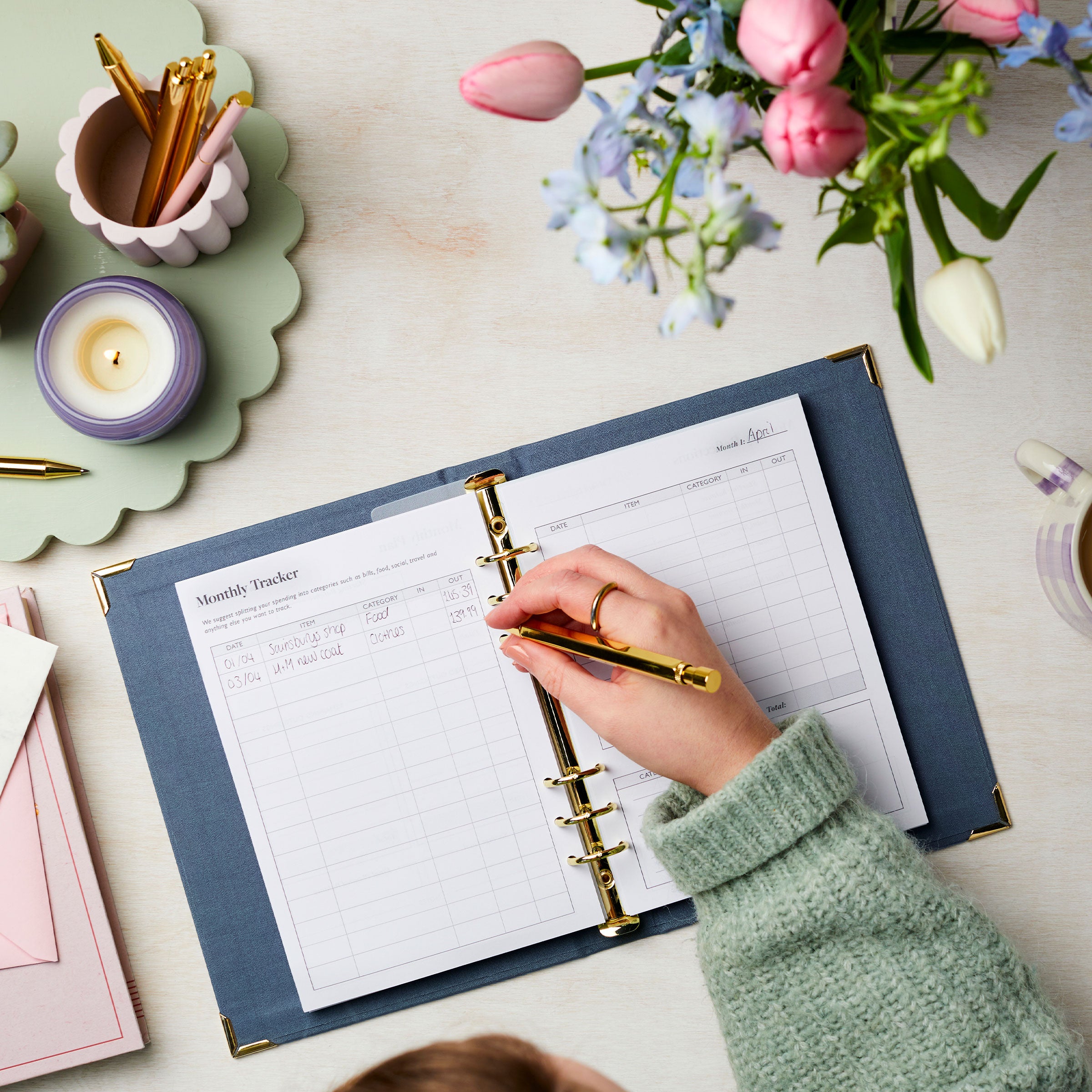 martha brook personalised stationery budget tracker planner on desk with purse adn flowers and pen pots