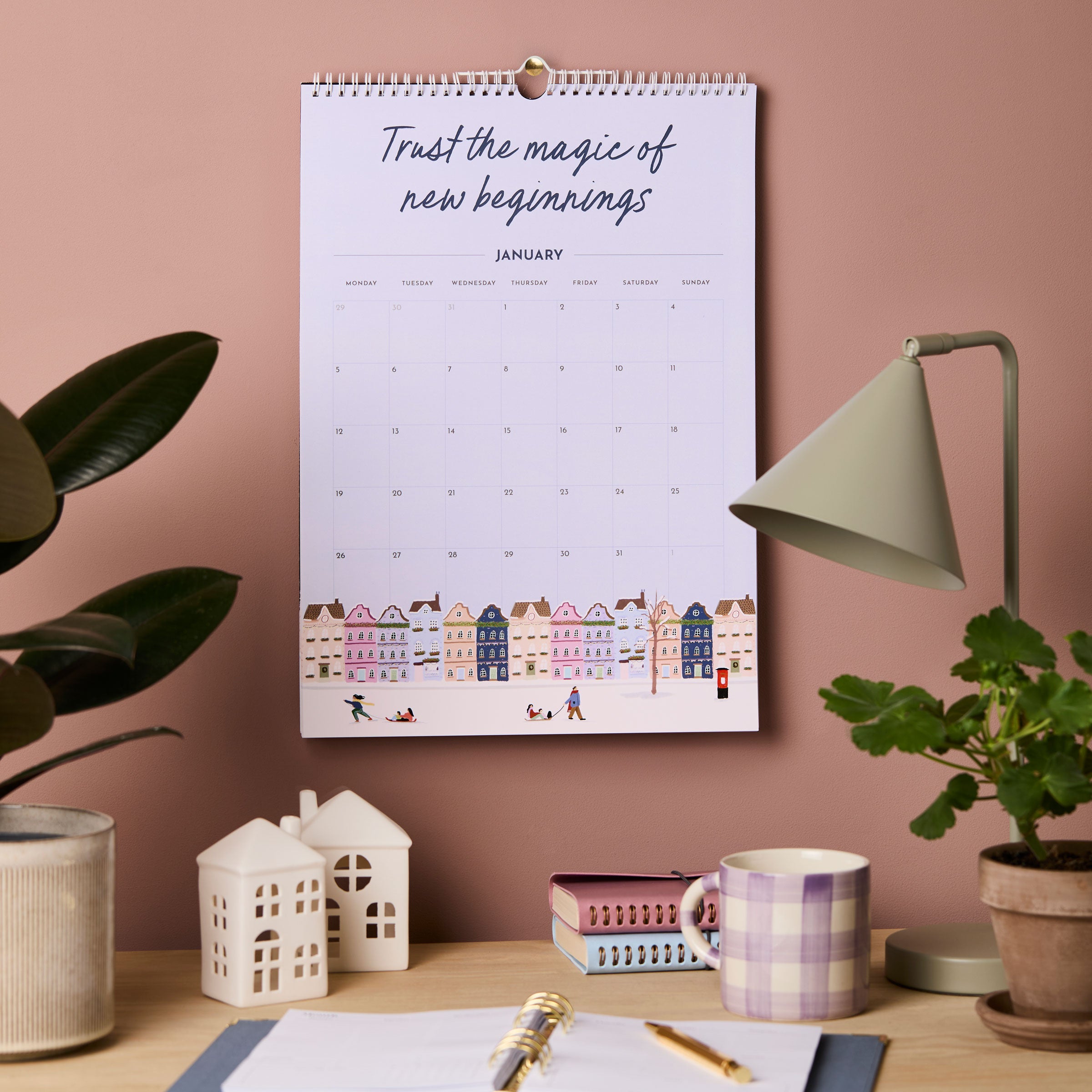 martha brook personalised stationery 2026 inspirational wall calendar above a wooden desk on a dusty pink wall