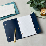 martha brook personalised stationery branded leather effect custom refillable notebook open blue notebook on desk flatlay