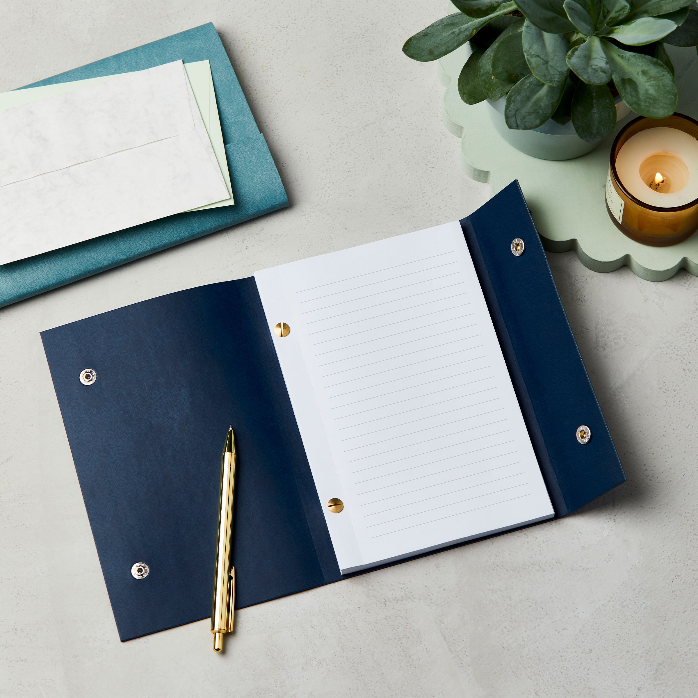 martha brook personalised stationery branded leather effect custom refillable notebook open blue notebook on desk flatlay