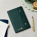 martha brook personalised stationery branded leather effect custom refillable notebook green leather notebook with logo on desk