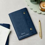 martha brook personalised stationery branded leather effect custom refillable notebook blue leather notebook with logo on desk