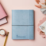 martha brook personalised stationery corporate notebooks branded leather effect notebook blue notebook with logo on pink desk