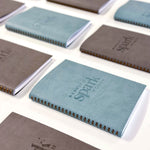 martha brook personalised stationery branded leather notebook blue and grey notebooks with logo on desk