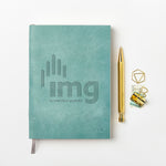 martha brook personalised stationery branded leather notebook blue leather notebook with logo on desk with gold pen