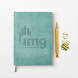 martha brook personalised stationery branded leather notebook blue leather notebook with logo on desk with gold pen