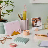 martha brook personalised stationery desk accessories on a desk with glasses and a plant