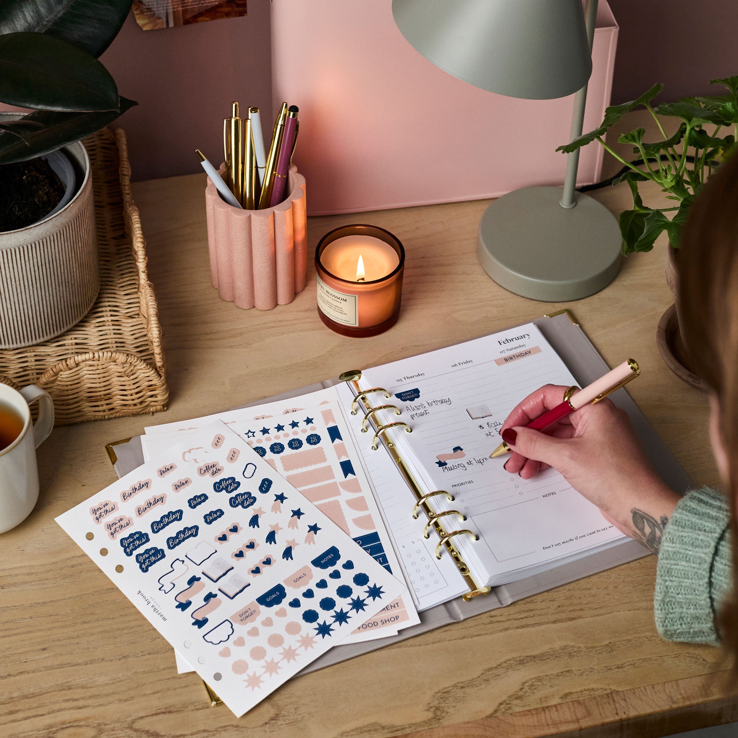 martha brook personalised stationery life planner stickers being stuck into a life planner on a desk