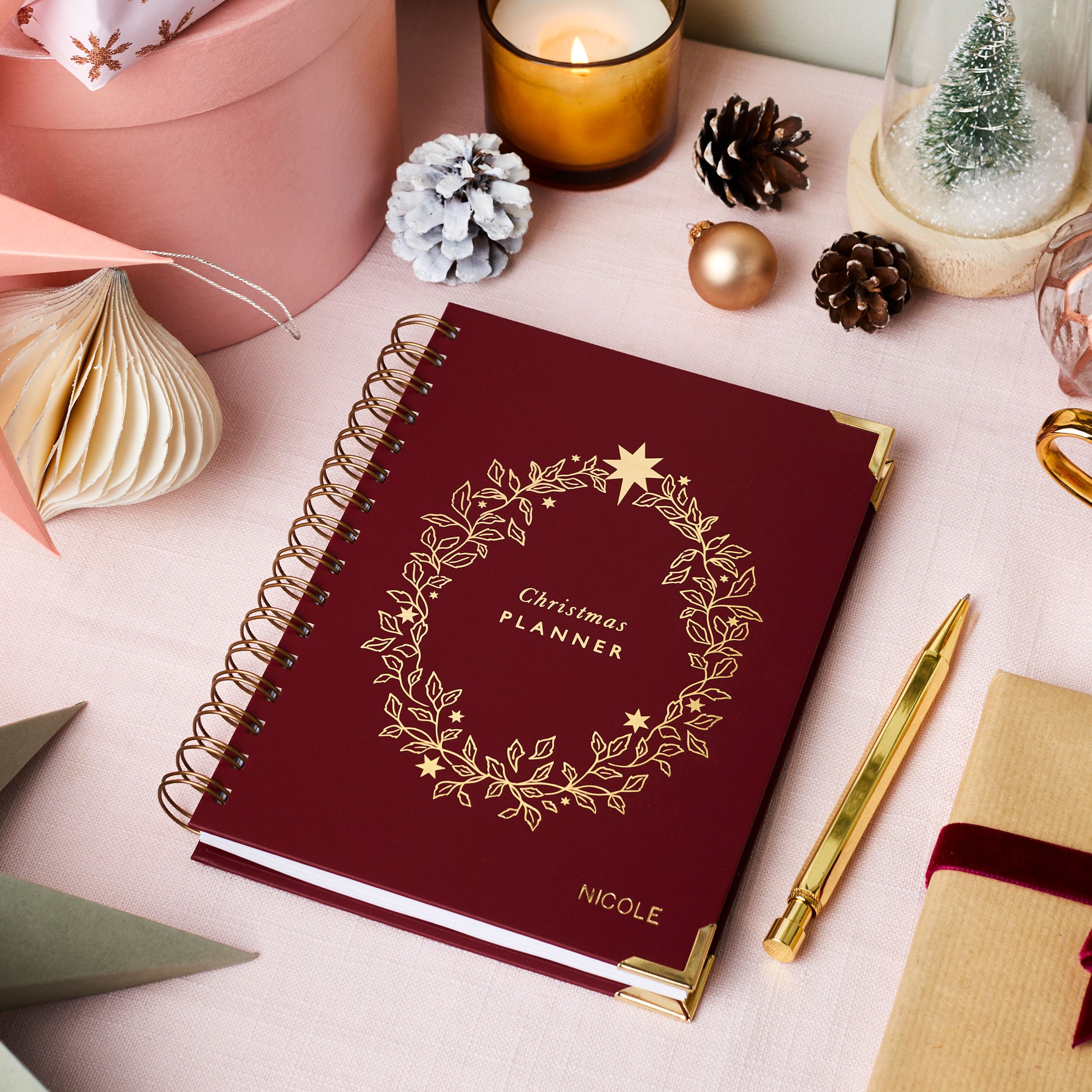martha brook personalised stationery personalised christmas planner in burgundy on table with Christmas presents and candle 1