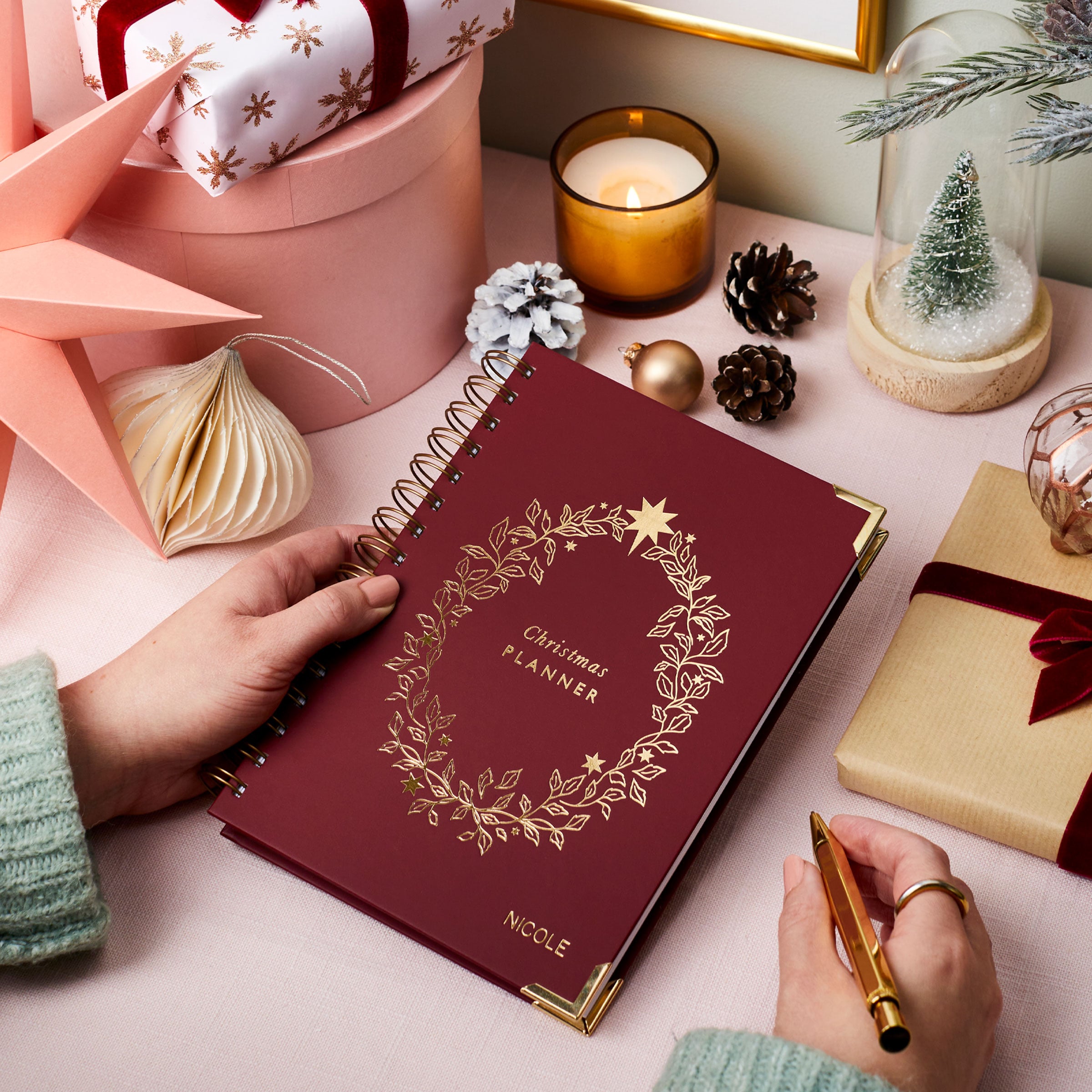 martha brook personalised stationery personalised christmas planner in burgundy on table with Christmas presents and candle 1