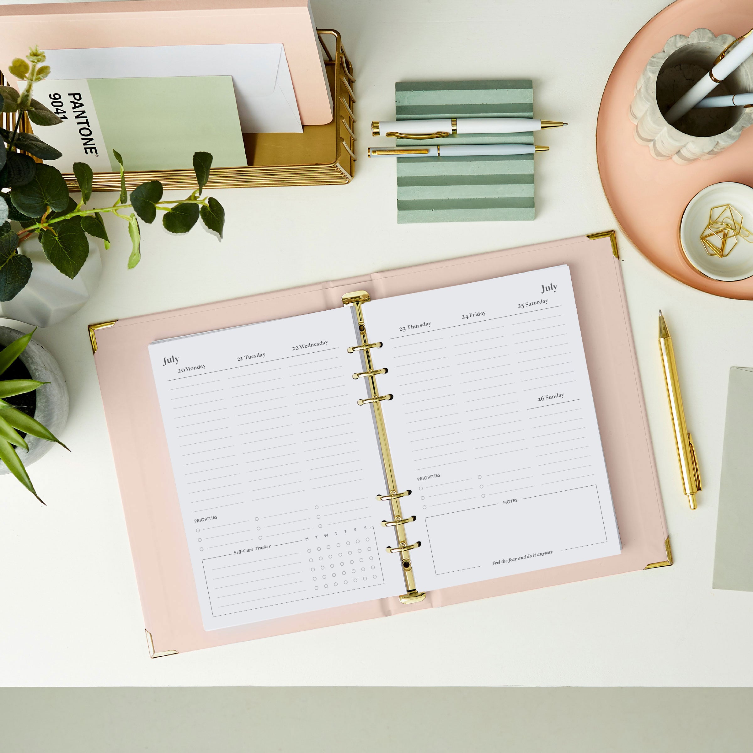 martha brook personalised stationery personalised dream plan do life planner inside pages 2026 weekly spread on a desk with a pastel scalloped pen pot and grooved pen holder