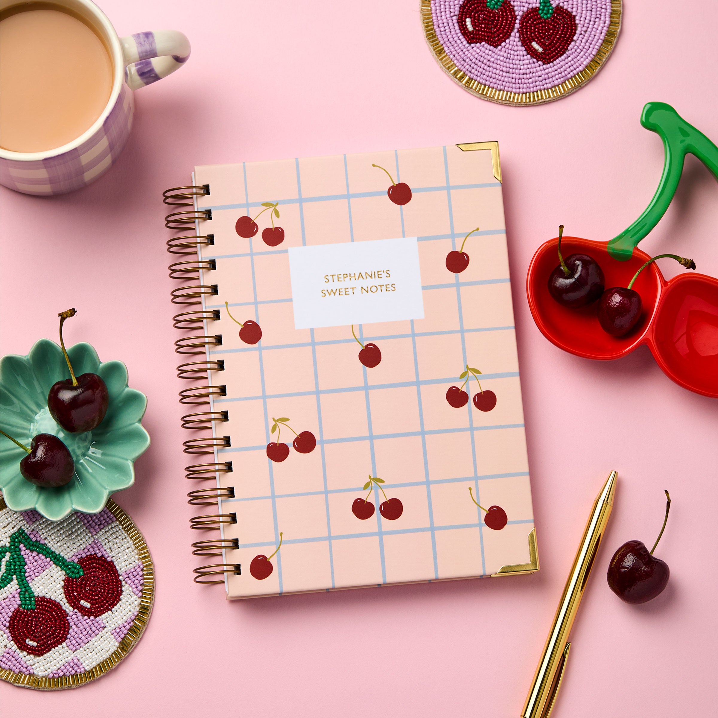 martha brook personalised stationery personalised hardback cherry notebook with cherry coaster and trinket dish on pink background