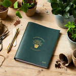 martha brook personalised stationery personalised leather effect gardening journal on gardening table with pots and seeds
