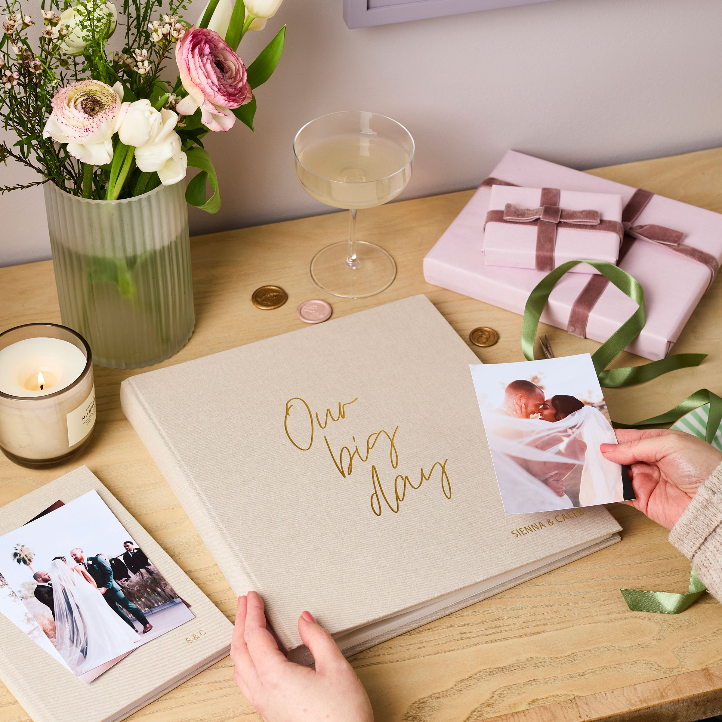 martha brook personalised stationery personalised linen wedding photo album on wooden table with presents and flowers