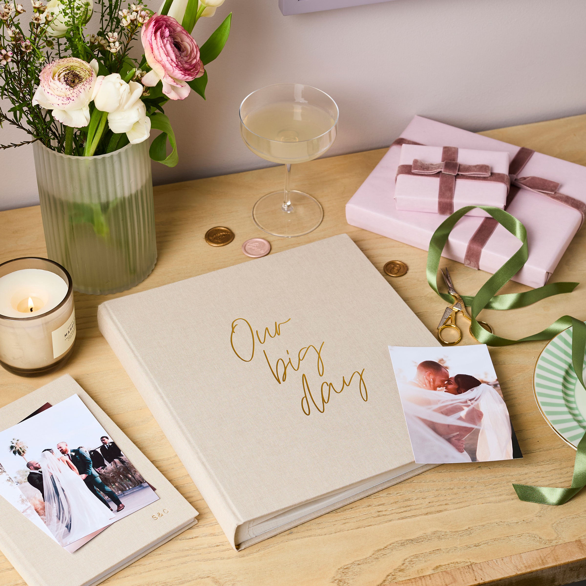martha brook personalised stationery personalised linen wedding photo album on wooden table with wedding photographs