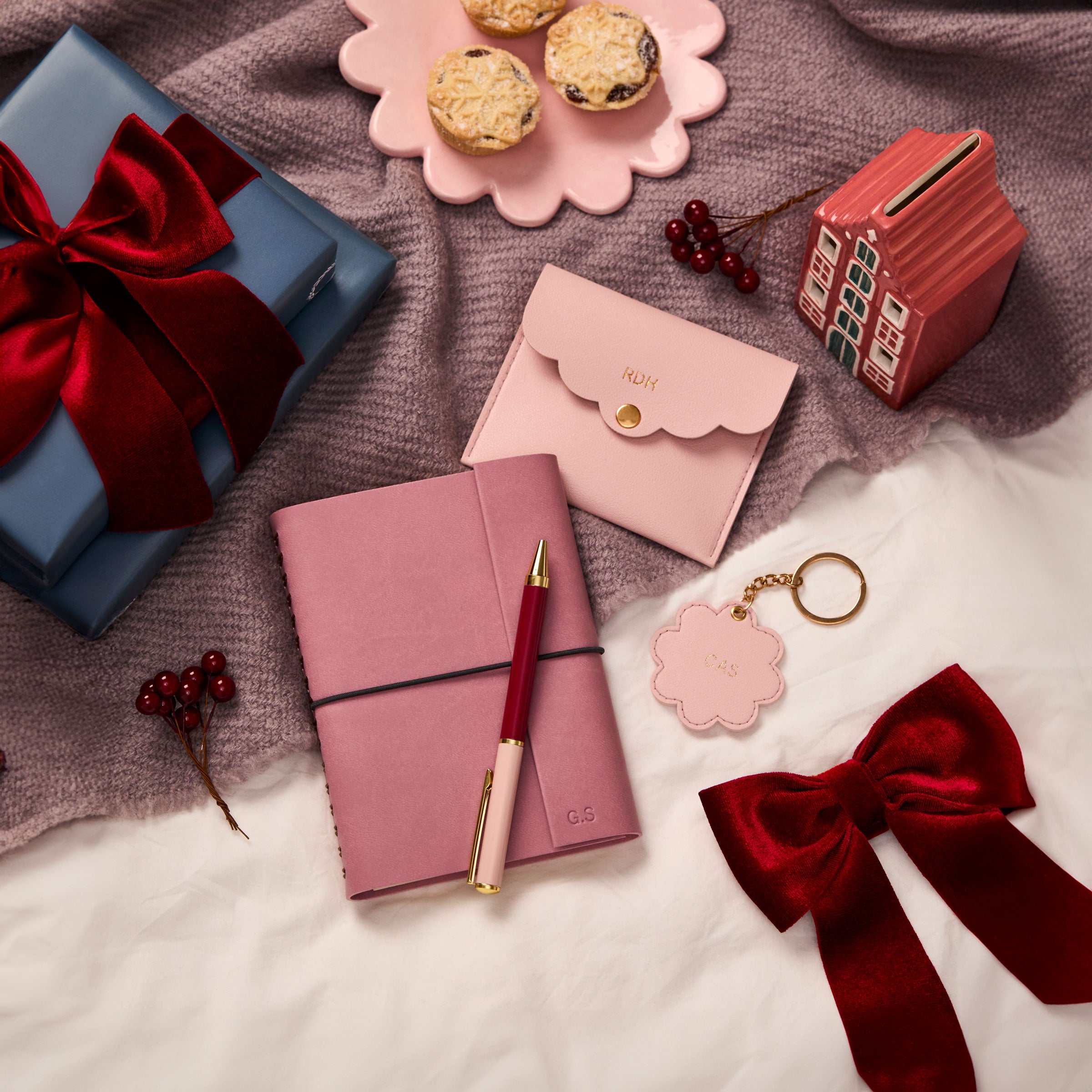 martha brook personalised stationery personalised little joys gift set on a festive bedspread with a painted ceramic house and ribbon wrapped presents