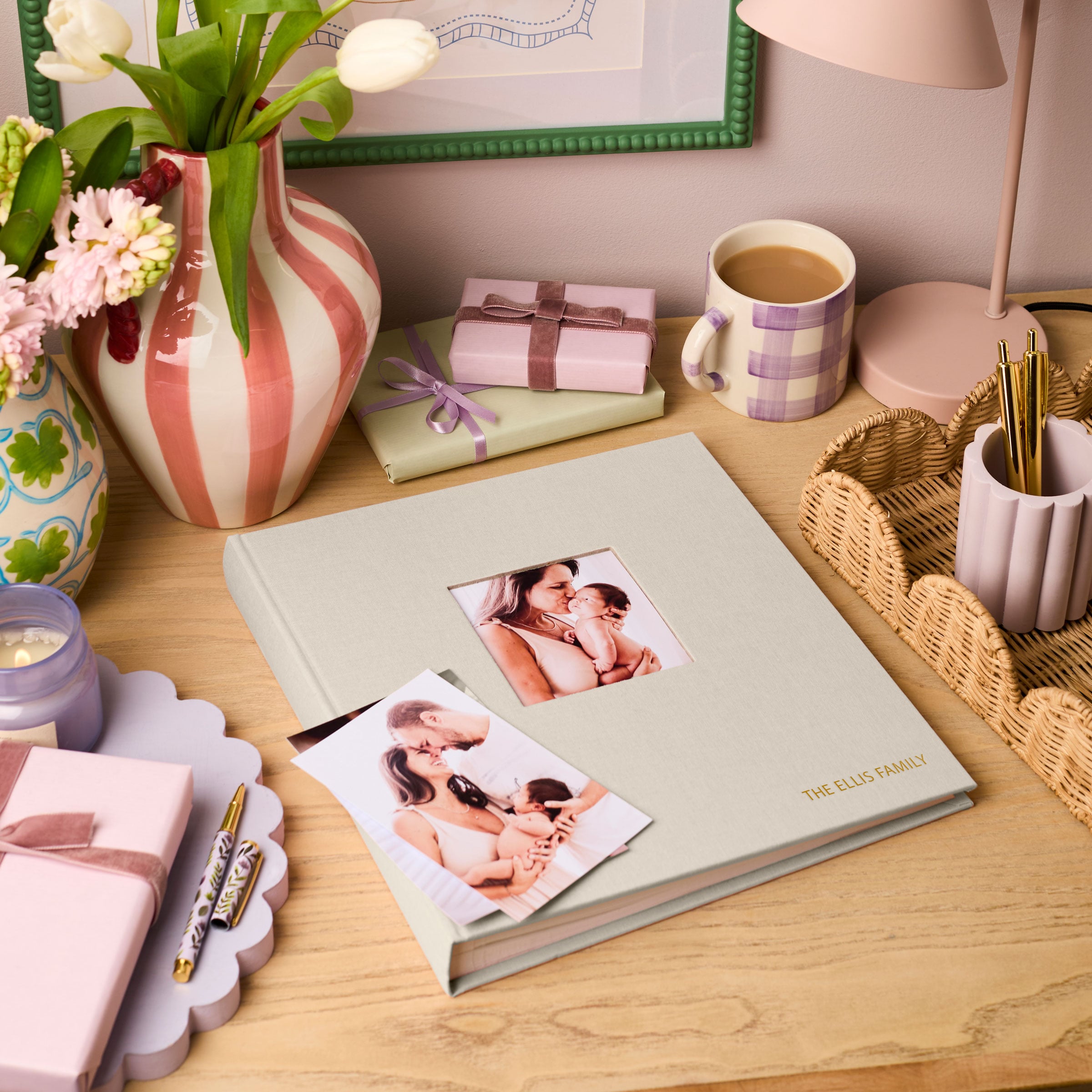 martha brook personalised stationery personalised luxury linen photo album in natural stone in a desk with pink striped vase and lilac checked mug