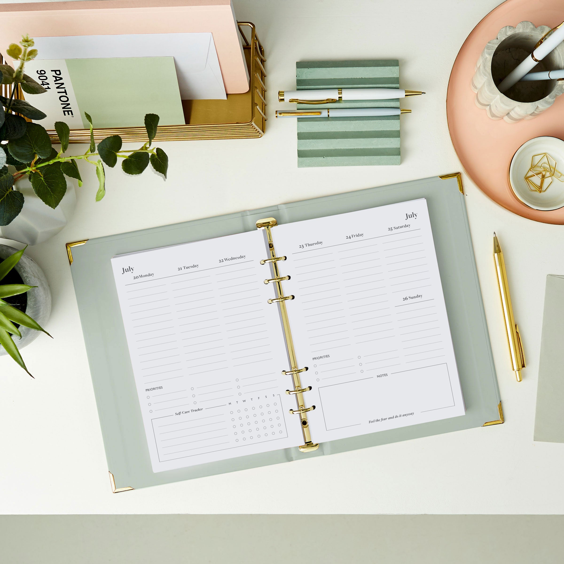martha brook personalised stationery personalised make it happen life planner inside pages 2026 weekly spread on a desk with a pastel scalloped pen pot and grooved pen holder