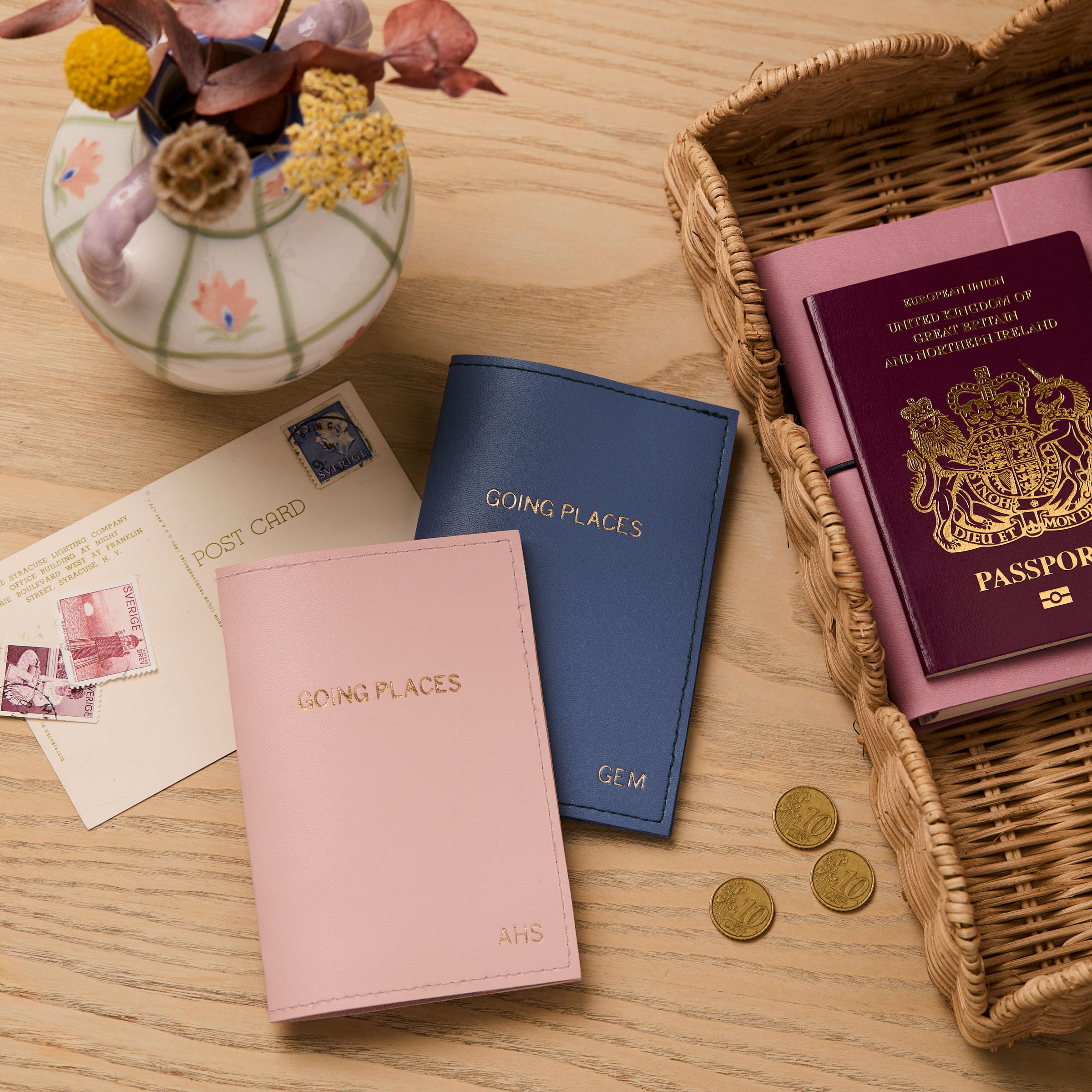 martha brook personalised stationery personalised passport holder on a wooden desk with a passport and postcards