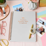 Martha Brook personalised stationery personalised scrapbook gift set scrapbook on desk with polaroid images around it, a roll of washi tape and a gold pen on top