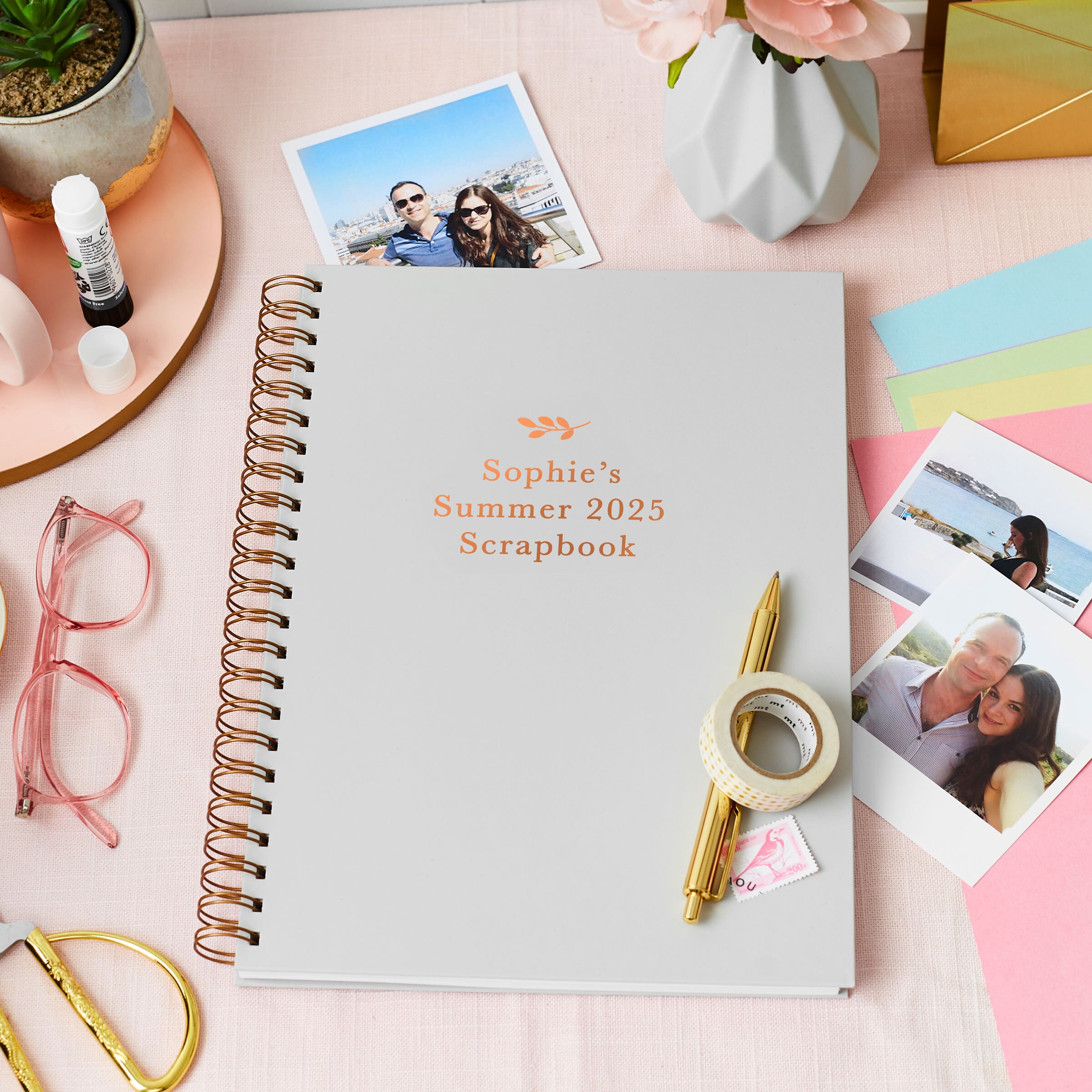 Martha Brook personalised stationery personalised scrapbook gift set scrapbook on desk with polaroid images around it, a roll of washi tape and a gold pen on top