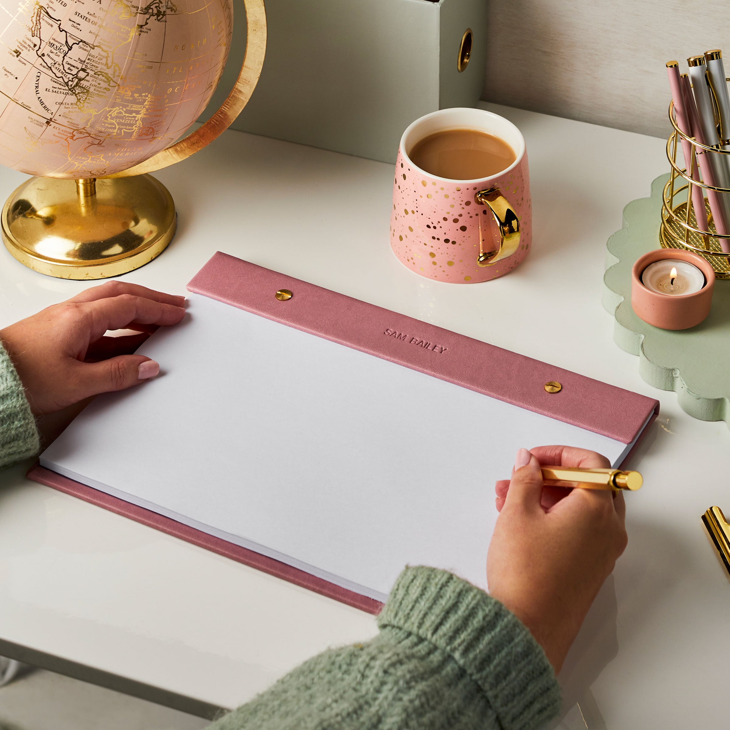 martha brook personalised stationery personalised vegan leather a4 refillable desk pad dusky pink on desk with pink globe and magazine holder