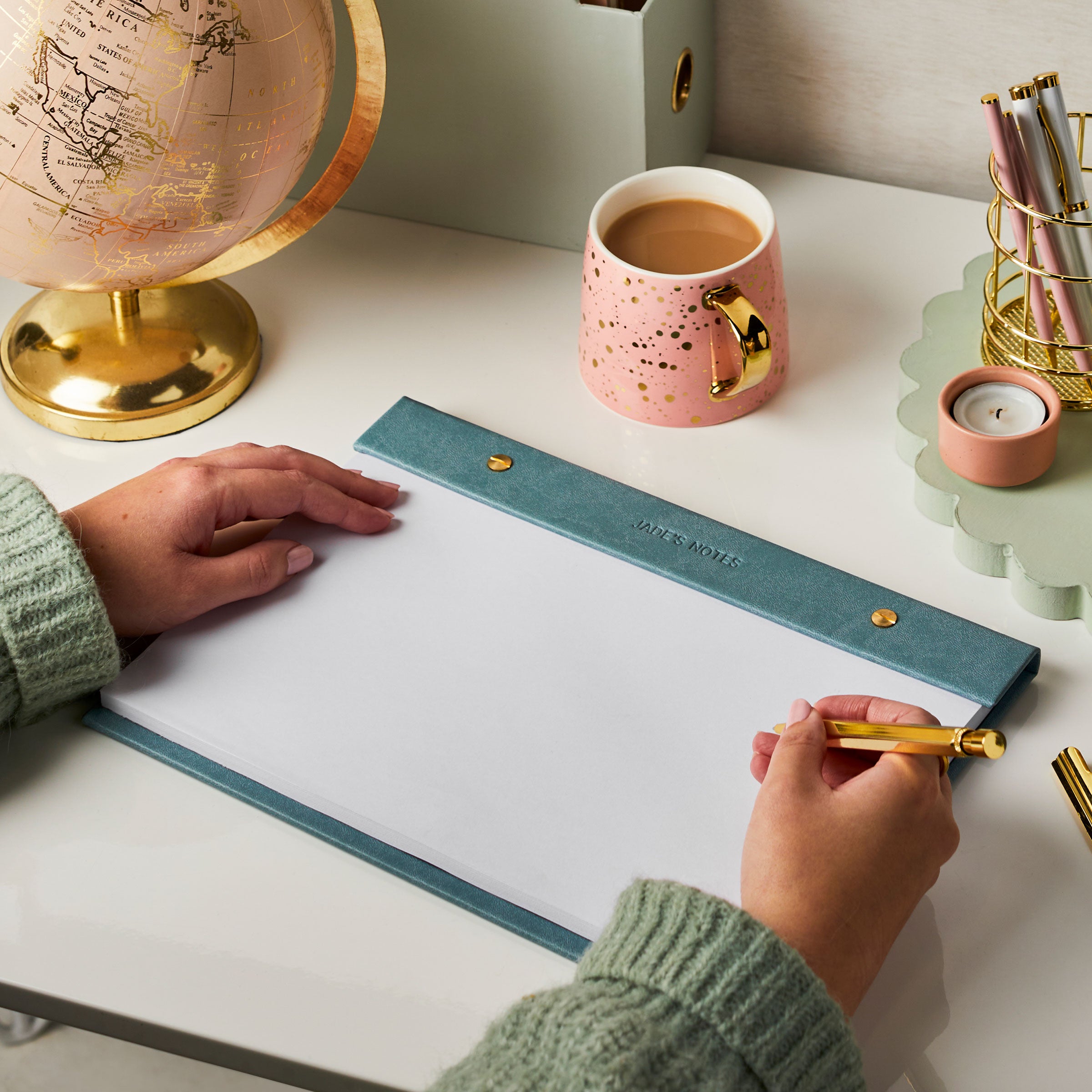 marth brook personalised stationery personalised vegan leather a4 refillable desk pad teal with pink globe and candle and mug on desk