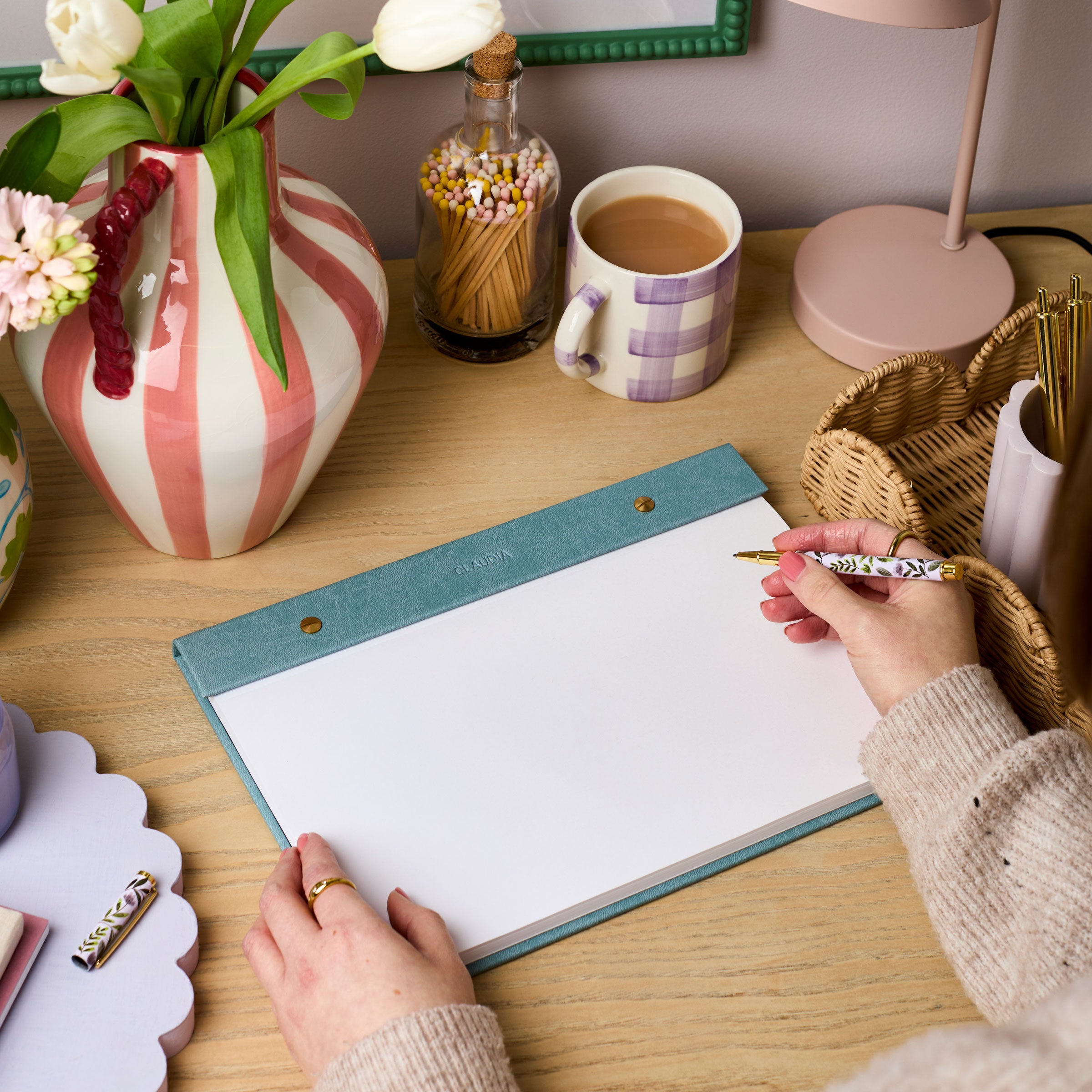 martha brook personalised stationery personalised vegan leather a4 refillable notepad in teal on a desk with pink striped vase and lilac check mug