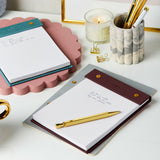 martha brook personalised stationery personalised vegan leather winter berry refillable notepad on a desk with a matching teal refillable notepad and marbled scalloped pen pot