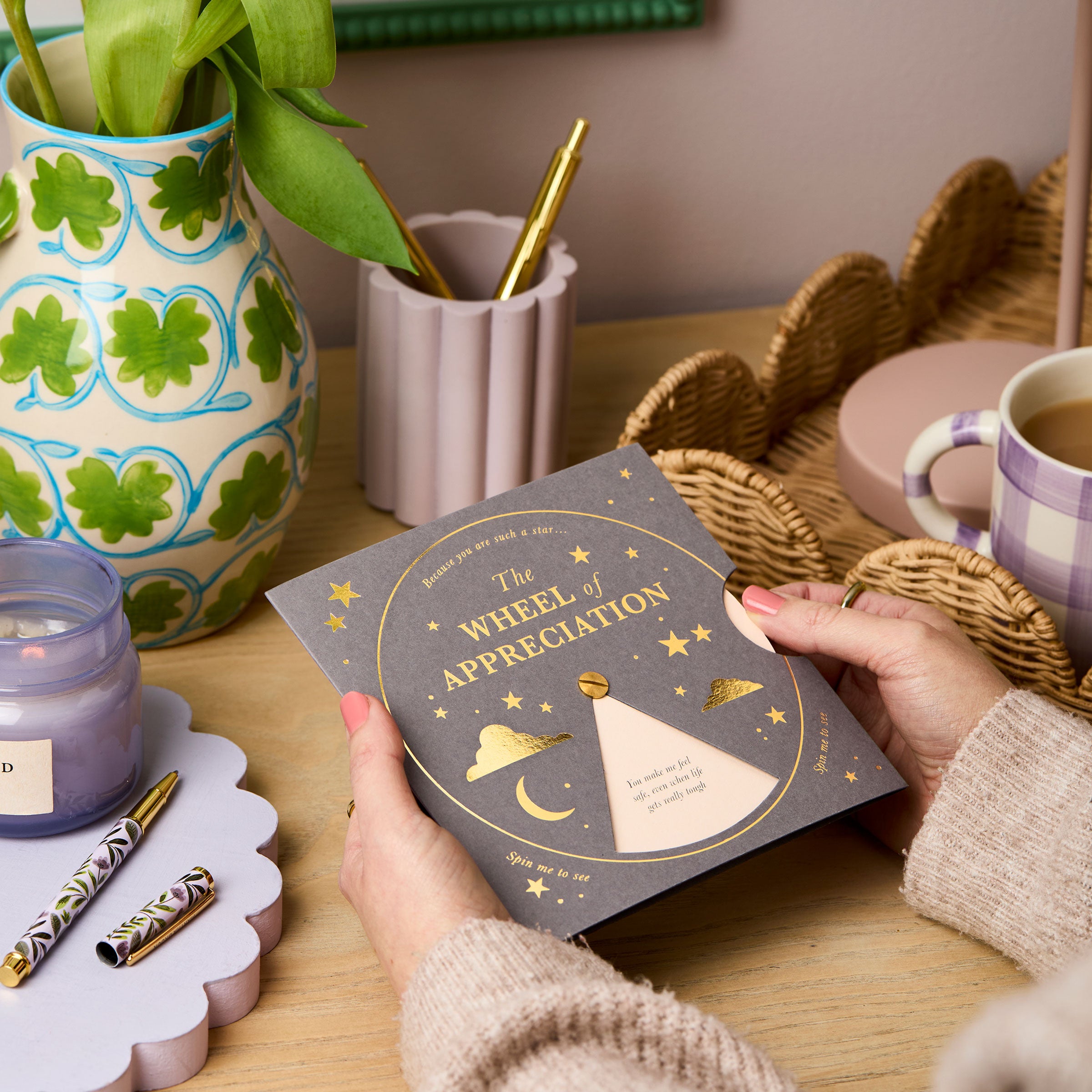 martha brook personalised stationery the appreciation reveal wheel on a desk with a lilac scalloped pen pot and rattan tray