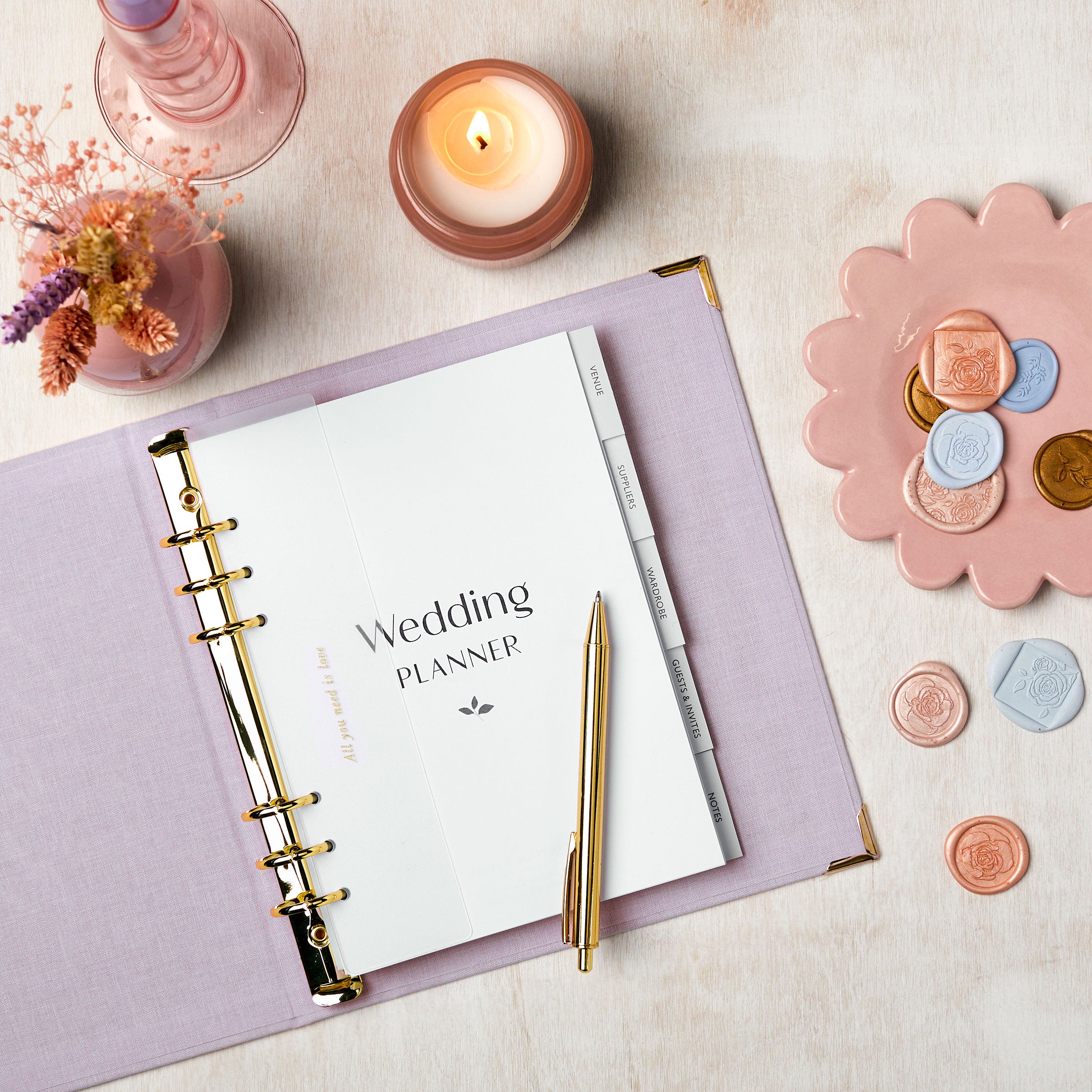 martha brook personalised stationery wedding stationery personalised lilac wedding planner and organiser on table with photos and scissors and ribbons