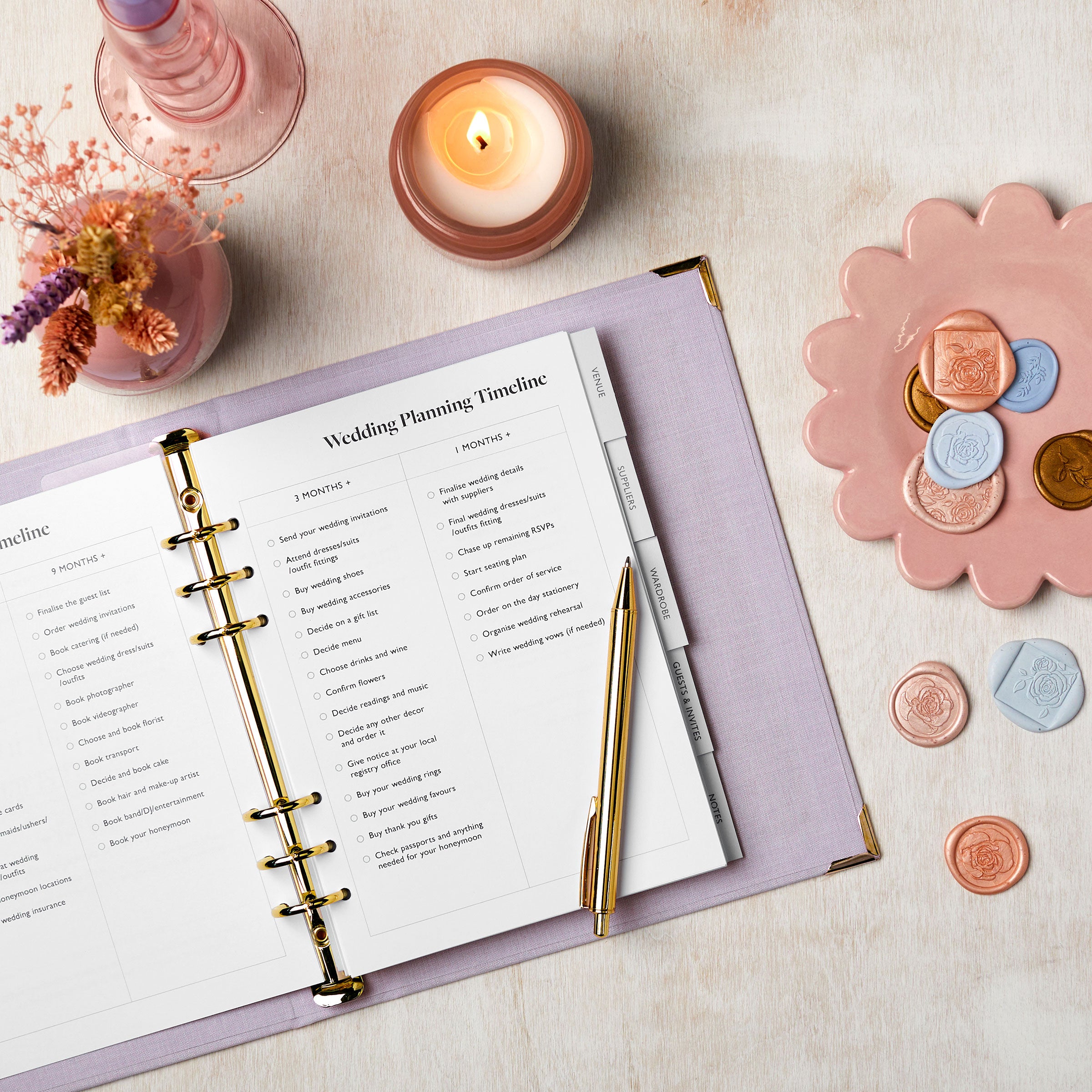 martha brook personalised stationery wedding stationery personalised lilac wedding planner and organiser on table with photos and scissors and ribbons