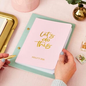 martha brook personalised stationery pink diary on desk being held by hands
