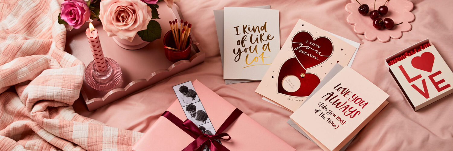 martha brook blog post 30 wonderful valentine's messages to write in a card valentine's setup with candle and cards on pink bed