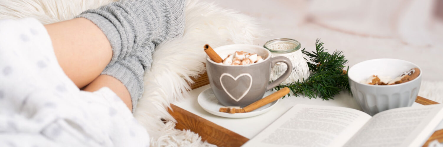 martha brook blog post things to do in between Christmas and New Year cosy day in reading a book with a hot chocolate