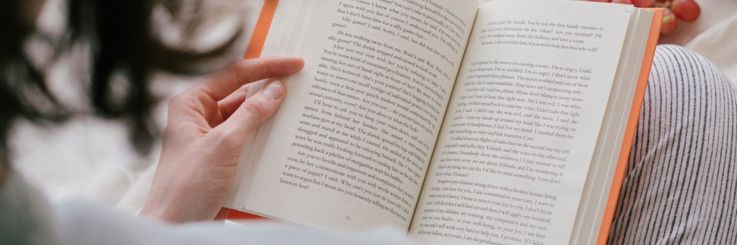 martha brook blog post 10 brilliant gifts for book lovers lady reading a book in pjamas