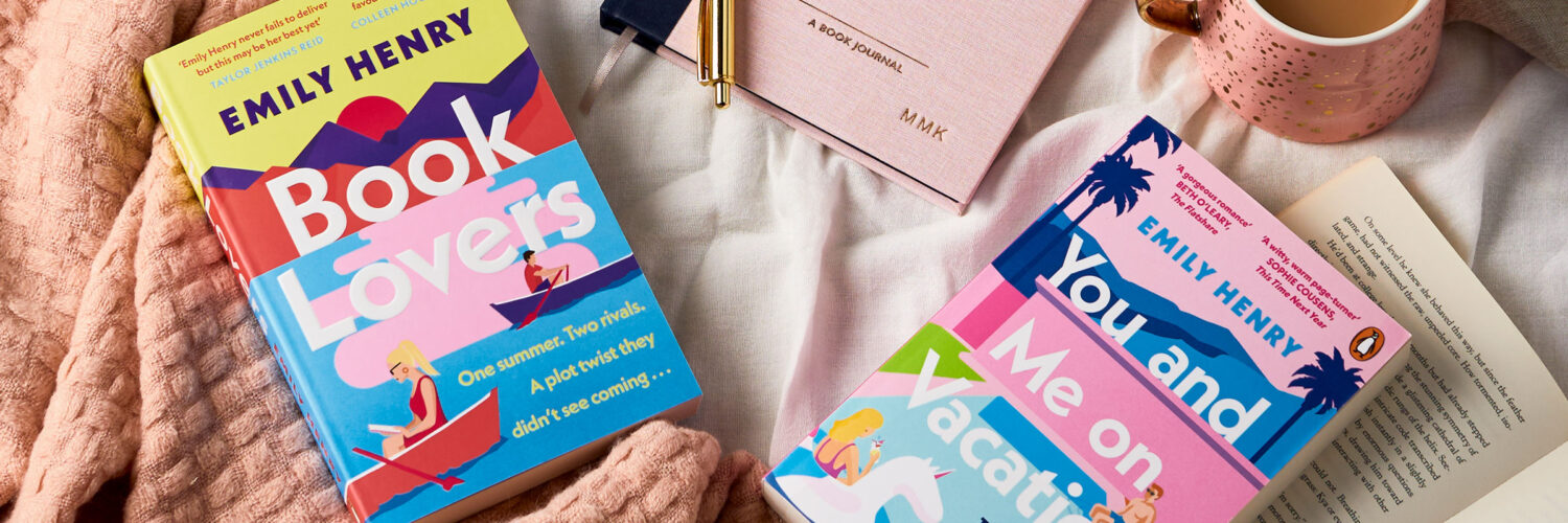 martha brook blog post a review of happy place by emily henry her books on a bed with a blanket and a martha brook book journal