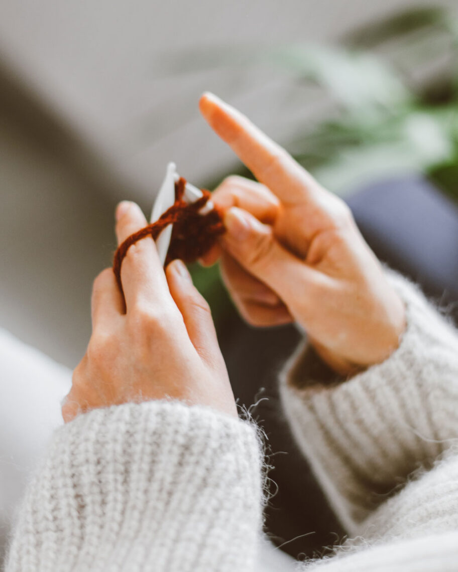 martha brook personalised stationery blog 10 things to do in the summer to keep the whole family entertained close up of someone knitting using brown wool