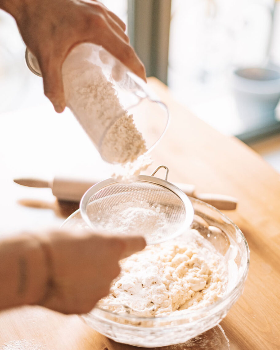 martha brook personalised stationery blog 10 things to do in the summer to keep the whole family entertained person sieving flour into a glass bowl