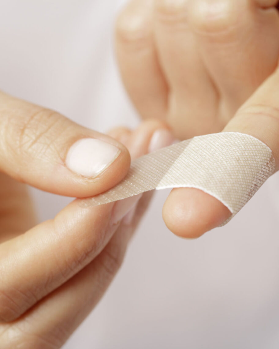 martha brook personalised stationery blog 15 things to take on holiday that you’ll wish you’d thought of sooner first aid kit. Person putting a white adhesive bandage or plaster onto their finger