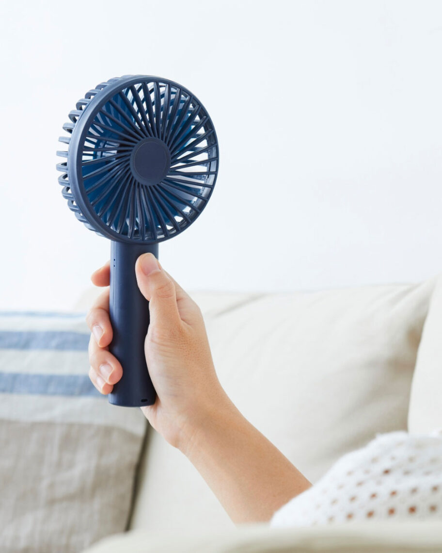 martha brook personalised stationery blog 15 things to take on holiday that you’ll wish you’d thought of sooner handheld fan. Person holding up a small blue handheld fan