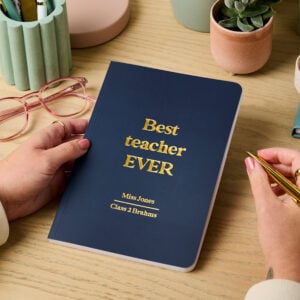 Martha brook personalised stationery personalised teacher gift softback notebook navy notebook with gold foil reading 'best teacher ever'