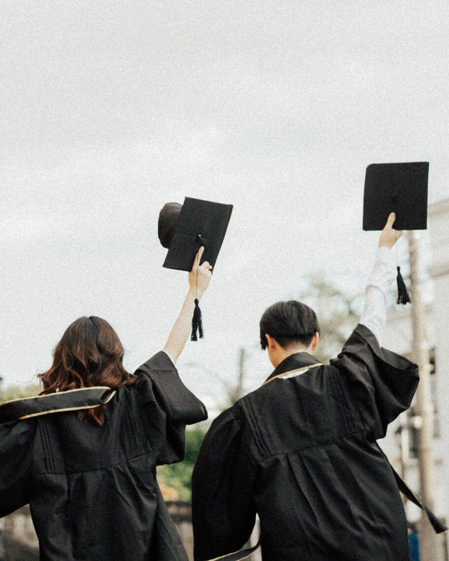 Martha Brook personalised stationery blog Our university essentials and top tips if you’re heading off to study this year woman and man graduating and holding caps in the air
