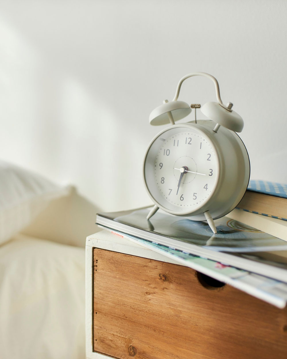 Martha Brook personalised stationery blog Our university essentials and top tips if you’re heading off to study this year white alarm clock on a  wooden bedside table