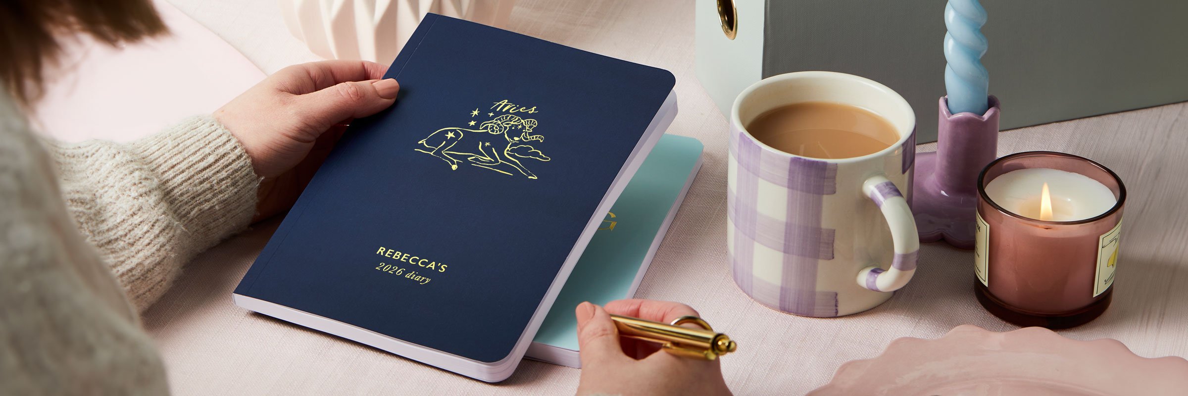 martha brook personalised stationery personalised softback 2026 diaries. A navy blue softback with a zodiac illustration on the cover in gold foil